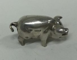 A silver cast figure of a pig. London 1994.