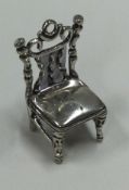 A miniature silver chair.