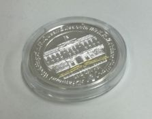 A Queen Elizabeth II silver 25 gram coin.