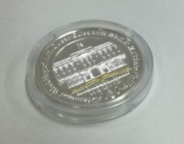 A Queen Elizabeth II silver 25 gram coin.