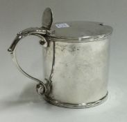 An early 18th Century Georgian silver mounted glass mustard pot.