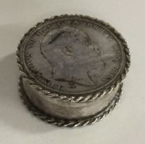 A silver coin box with lift-off cover.
