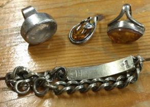 A heavy silver bracelet together with rings etc. A