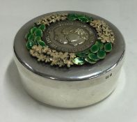STUART DEVLIN: A heavy silver and enamelled box decorated with flowers. London 1981.