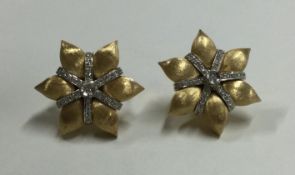 A good large pair of 18 carat two colour gold star shaped earrings.