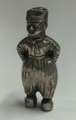 A silver pepper in the form of a boy. Marked to base.