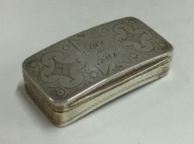 A George III silver snuff box with bright cut decoration.