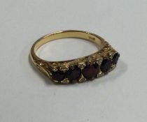 A good Victorian garnet five stone half hoop ring set in 18 carat gold.