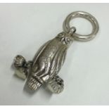 A Sterling silver rattle in the form of an owl.