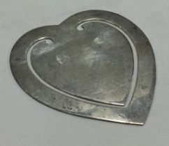 A Continental heart shaped silver money clip.