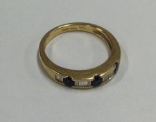 A good sapphire and diamond half eternity ring in 18 carat gold rubover mount.