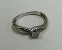 A small diamond single stone ring in 9 carat mount.