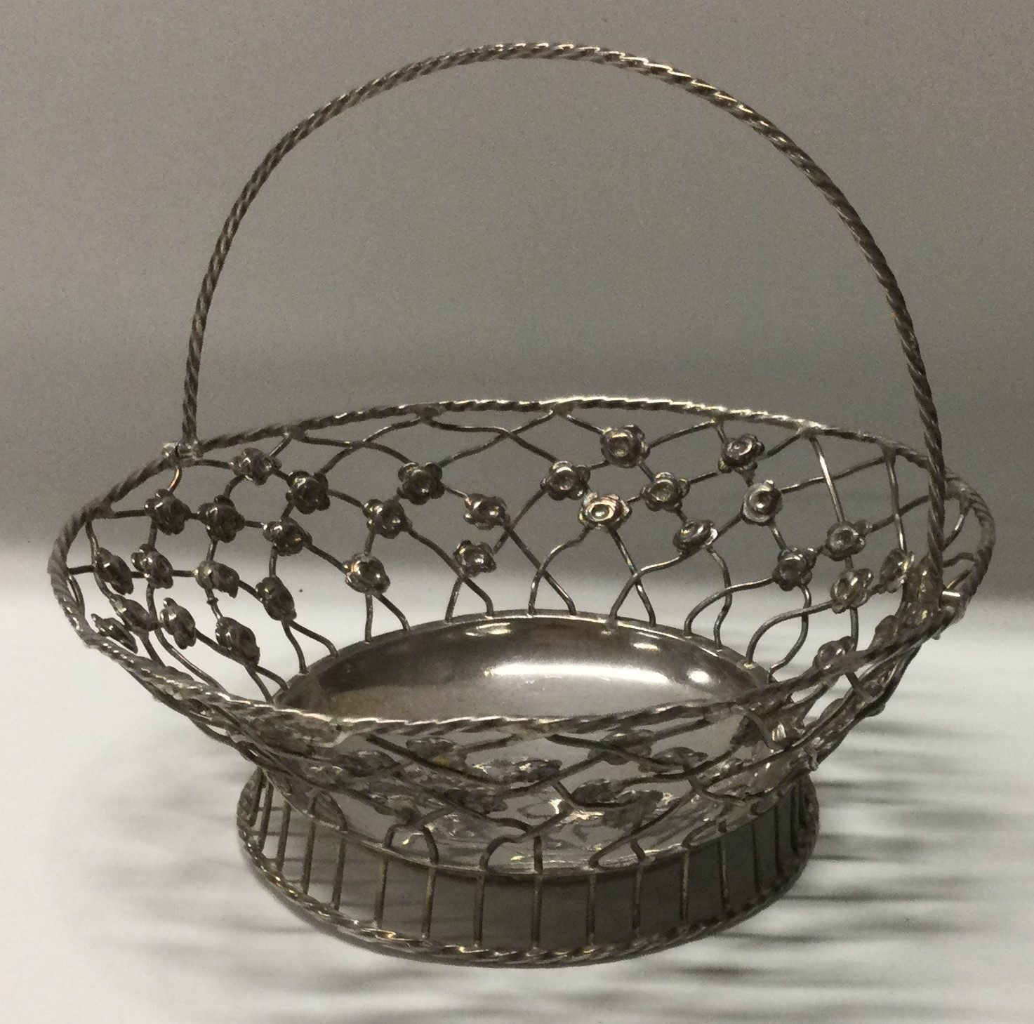 An 18th Century silver swing handled pierced basket. - Image 2 of 3