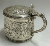 A Victorian silver and glass mustard pot. London 1876.