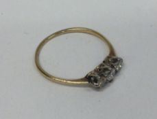 A good diamond three stone ring in two colour gold setting.