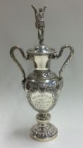 A fine silver figural cup and cover with embossed decoration. Birmingham 1948.