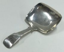 A George III plain silver caddy spoon. Birmingham 1828.