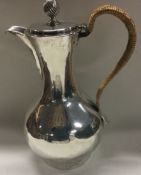 DUBLIN: An 18th Century Irish silver jug with crested decoration. Circa 1780.