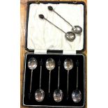 A boxed set of six silver teaspoons together with two others.