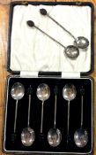 A boxed set of six silver teaspoons together with two others.