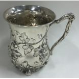 A good silver chased mug with vine decoration. London 1872.