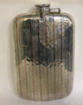 A large American silver and gold inlaid flask.