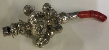A Georgian silver rattle mounted with coral teether.