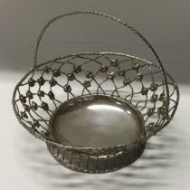 An 18th Century silver swing handled pierced basket.