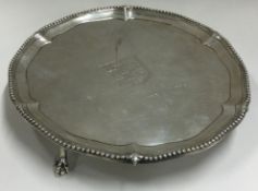 A heavy 18th Century silver salver with central armorial. London 1773.