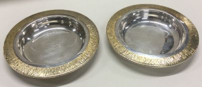 A pair of silver and silver gilt dishes. London 1973.