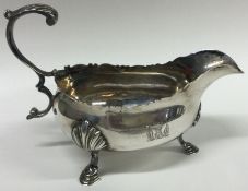An 18th Century silver crested sauceboat. London 1766.