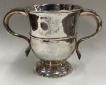 An early George I two handled silver cup. London circa 1730.
