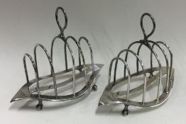 A pair of silver toast racks. London 1902.