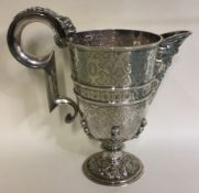 A heavy chased figural Continental silver jug.