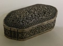 A chased Southern Asia silver hinged snuff box.