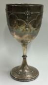 A Victorian silver chased goblet. London 1874.