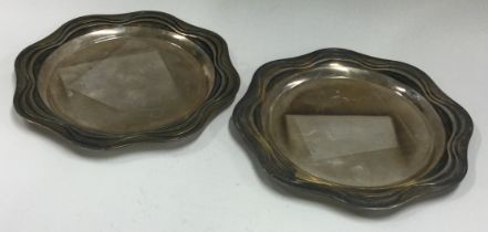 BRIAN ASQUITH A pair of silver dishes.