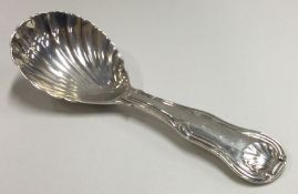 A heavy George III silver caddy spoon with fluted bowl. London 1816.