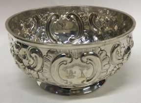 A chased Victorian silver bowl embossed with flowers. London 1890.