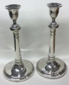 A large pair of Georgian silver crested candlesticks. London 1773.