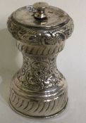 A chased silver pepper grinder. Sheffield.