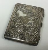 A chased silver embossed card case. London 1901.