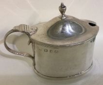 A silver and glass mustard pot. Birmingham 1893.