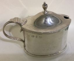 A silver and glass mustard pot. Birmingham 1893.