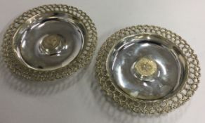 STUART DEVLIN: A pair of commemorative pierced dishes for the Silver Jubilee.
