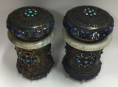 A pair of Chinese silver and jade tea caddies.