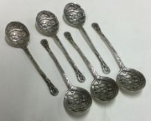 A collection of six Continental silver coffee spoons with dragon decoration.
