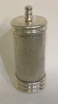 A good silver pepper grinder with textured bark finish.