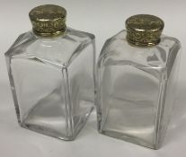 A pair of Georgian silver gilt and glass perfume bottles. London 1831.