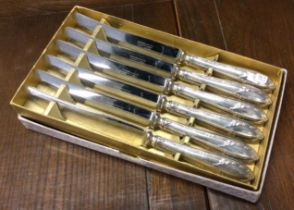 GARRARD & CO: A set of six cased silver handled table knives.